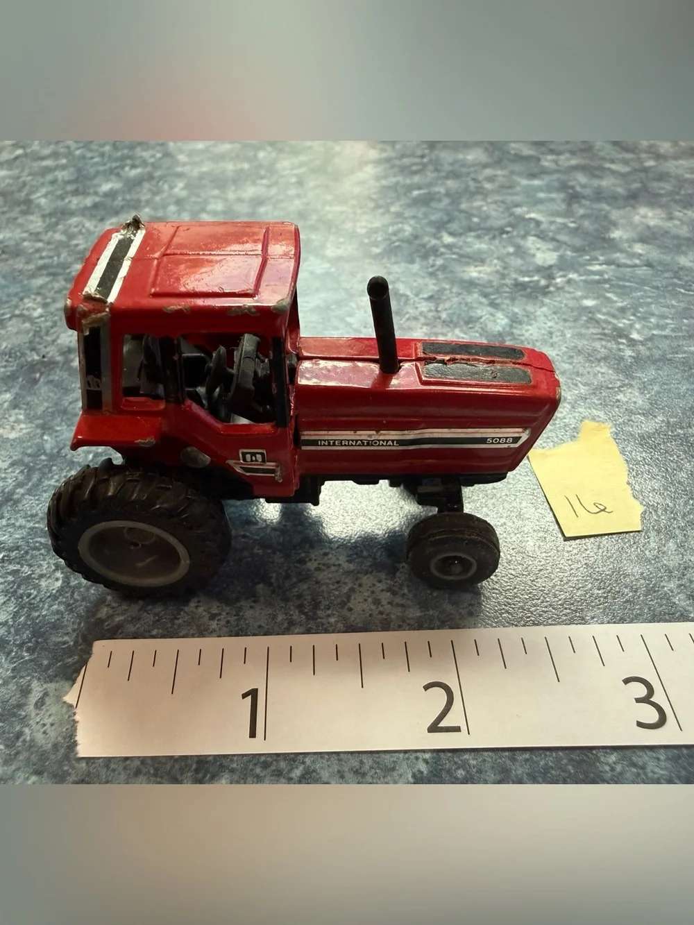 ERTL- Vintage 1/64 scale red harvester and matched grain wagon (set of 2 pieces)